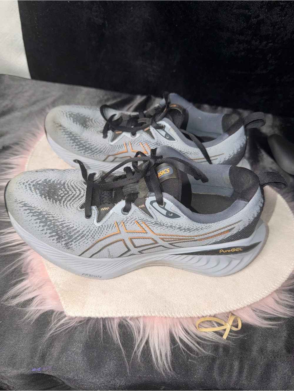 ASICS Women's Gray Athletic Running Shoes with Black Laces and Gold Accents